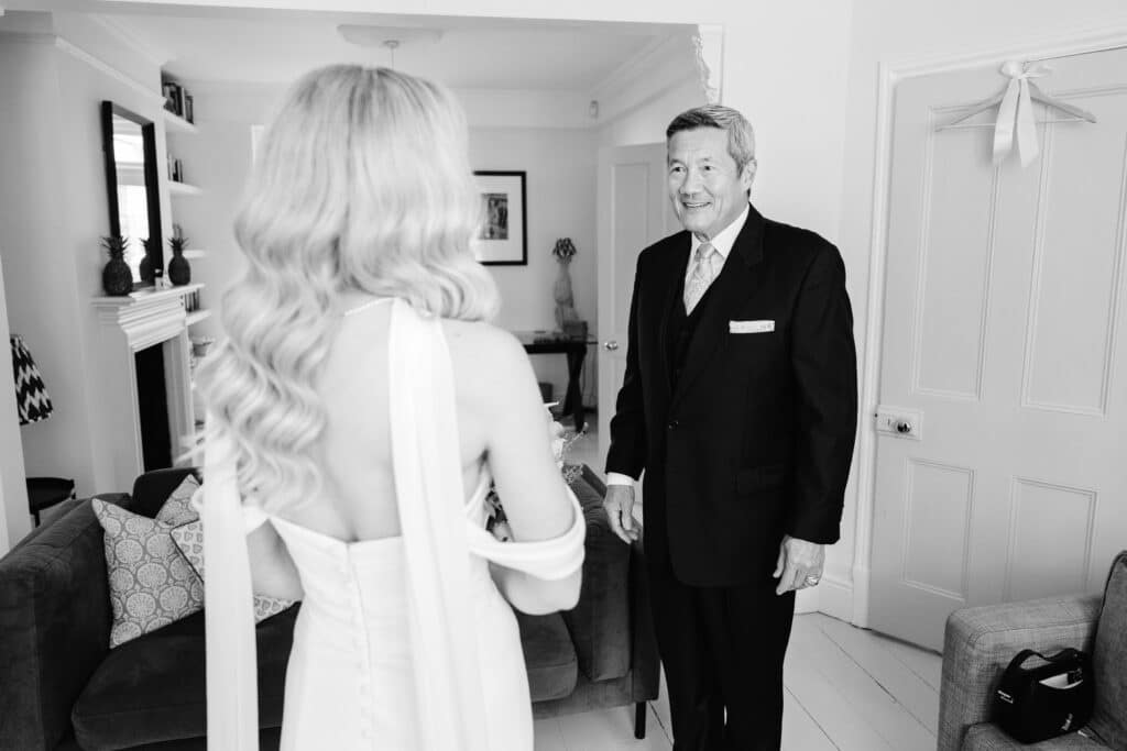 brides first look with dad during bridal prep in oxford