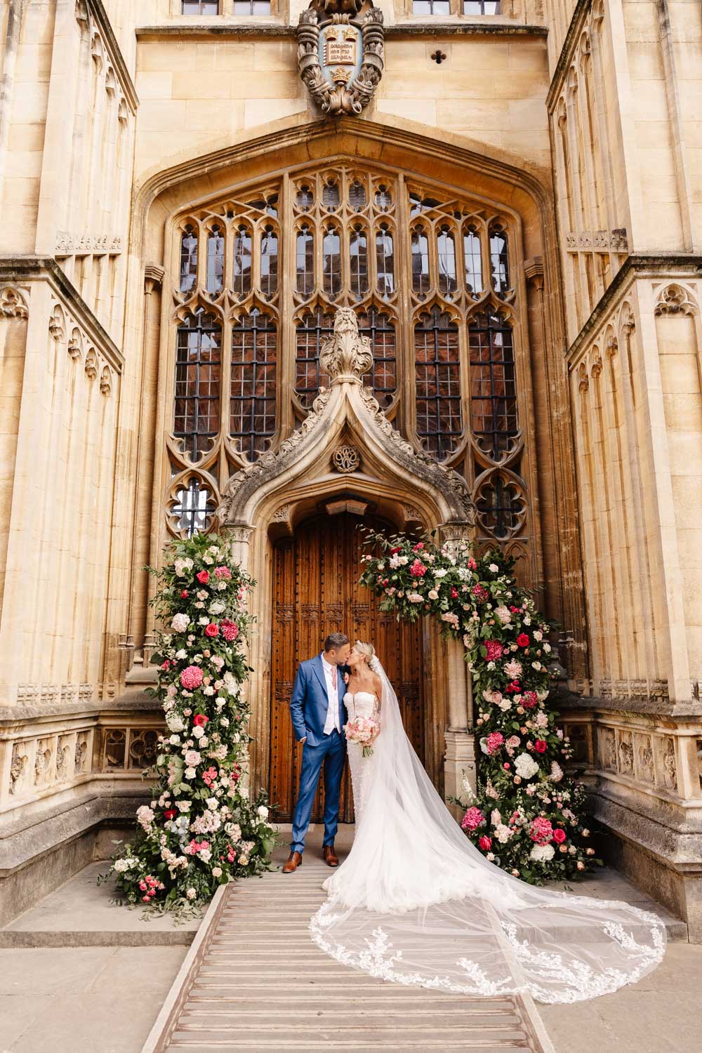 couple in bourton house gardens in the cotswolds during engagement photo shoot