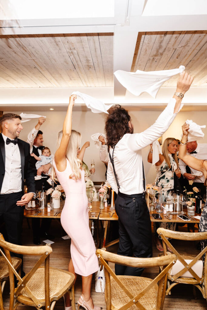 bride and groom enter wedding breakfast at wild thyme and honey in the cotswolds