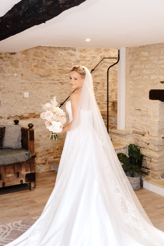 bridal portrait in structured satin wedding dress and veil