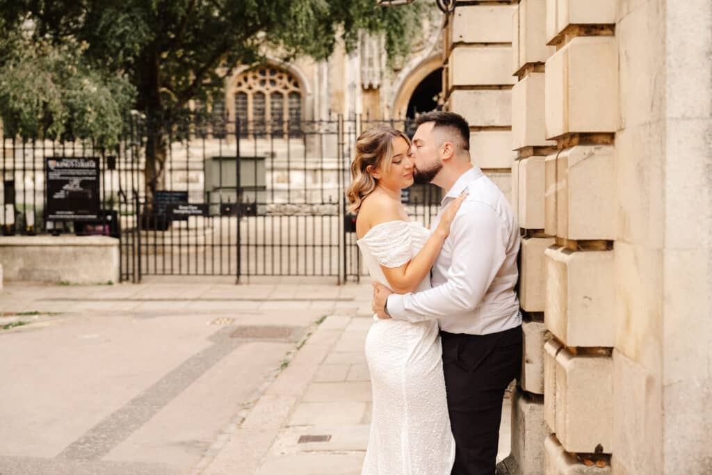 portraits of couple outside kings college during engagement shoot in cambridge